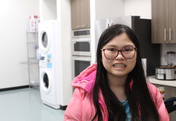 Student standing in the transitions lab