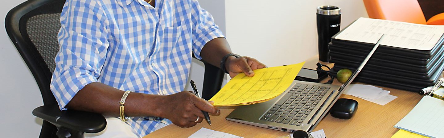 Teacher working on paperwork at his desk