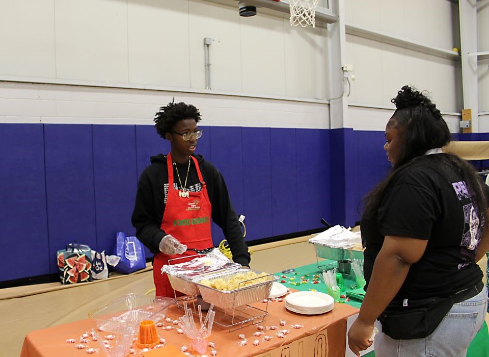 Student at table during cooking event