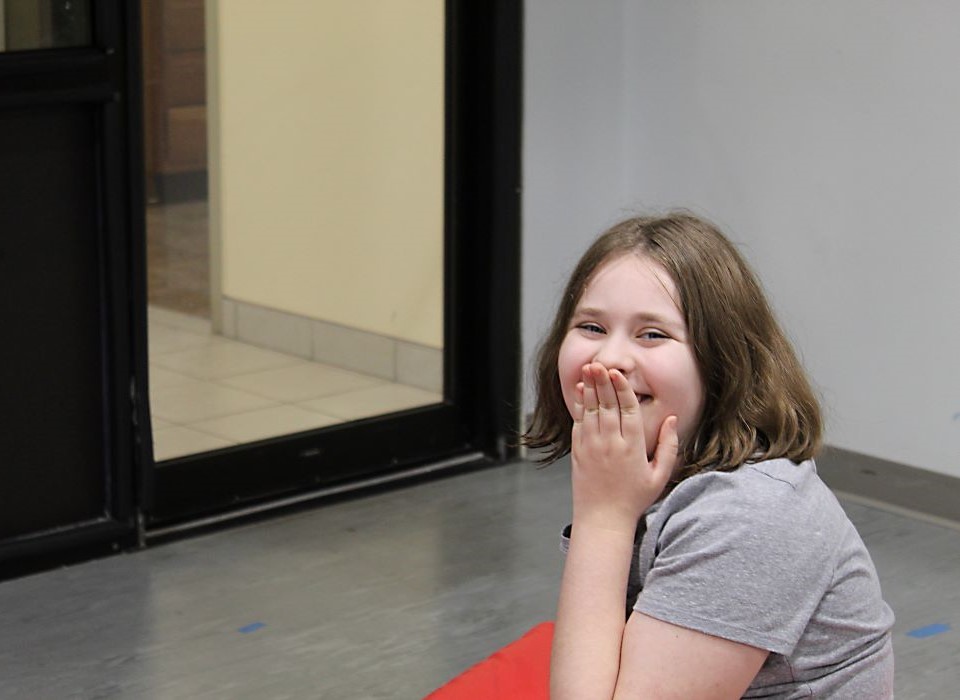 Student laughing in the hallway