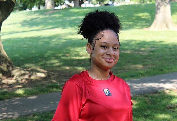 Student smiling at the park