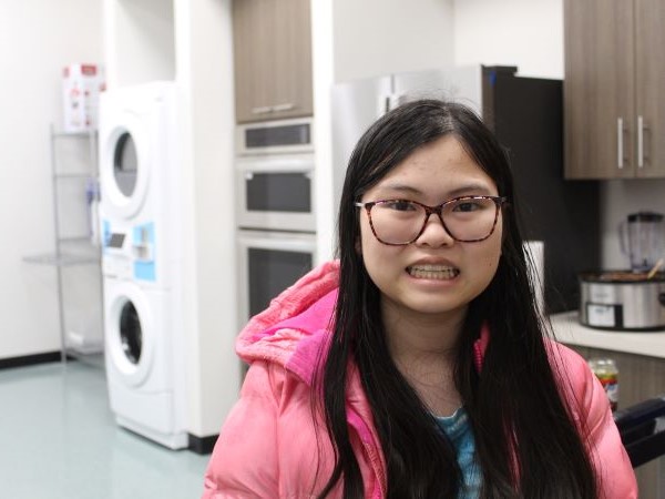 Student smiling in the transitions lab