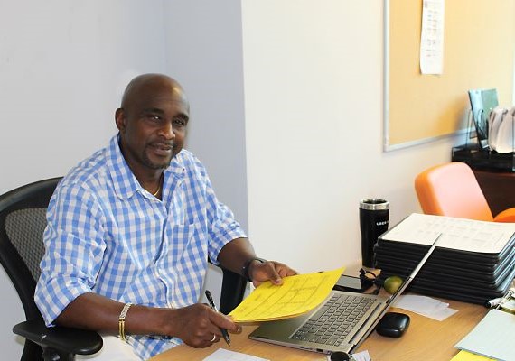 Teacher working at his desk