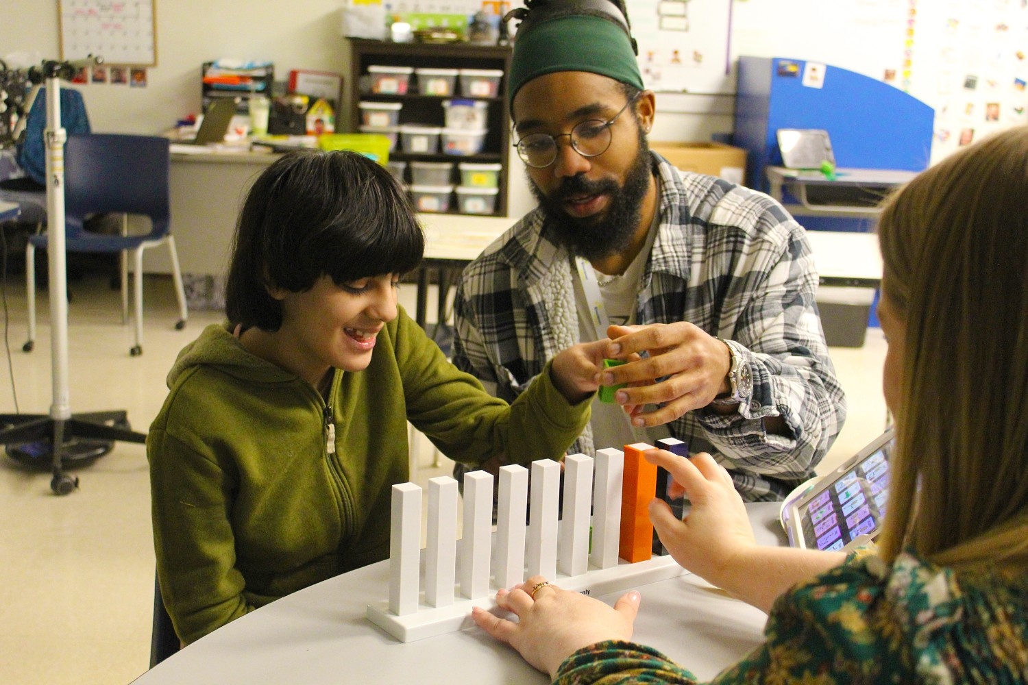student getting help from teacher