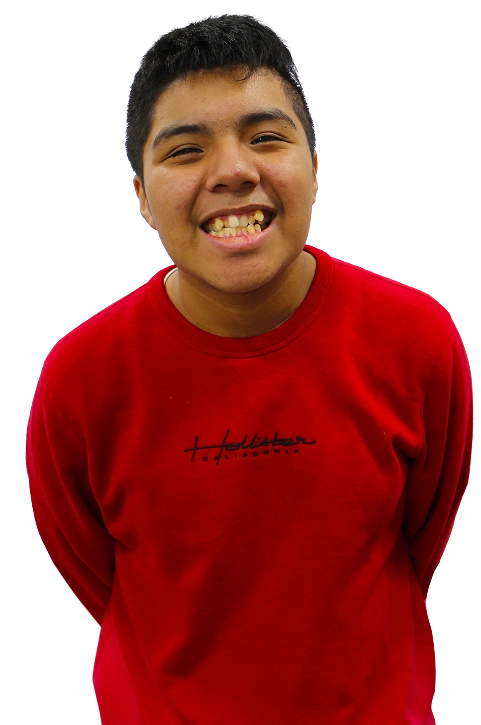 Smiling student wearing a red sweatshirt, standing and facing the camera